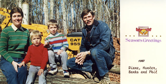 The optimistic land developer, Phil buys a caterpillar and a dump truck.